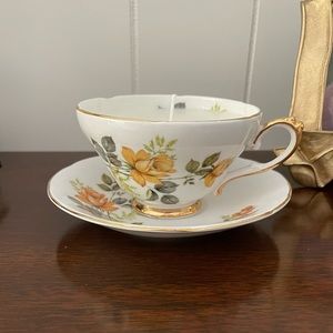 Hand poured soy wax candle in golden rose tea cup